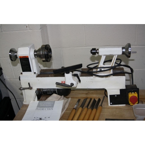 1065 - AN AXMINSTER APTC M330 WOOD LATHE total length 68cm with mandrill chuck, a set of six chisels and go... 