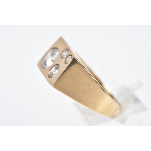 110 - A 9CT GOLD, CUBIC ZIRCONIA SET SIGNET RING, of a rectangular form set with four graduated circular c... 