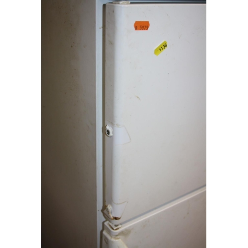 1130 - A WHIRLPOOL FRIDGE FREEZER 50cm wide 140cm high (handle to freezer broken and missing) working @ 0 a... 