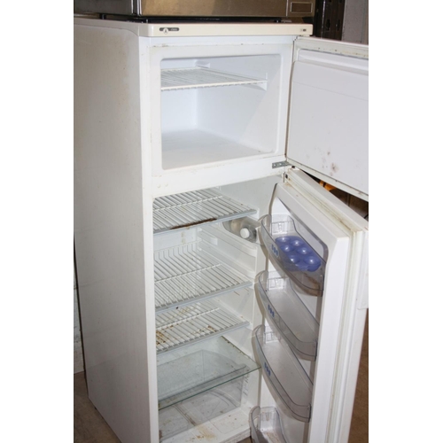 1130 - A WHIRLPOOL FRIDGE FREEZER 50cm wide 140cm high (handle to freezer broken and missing) working @ 0 a... 