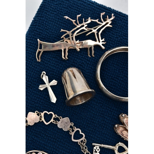 121 - A SELECTION OF SILVER AND WHITE METAL ITEMS, to include a silver charm bracelet suspending thirteen ... 