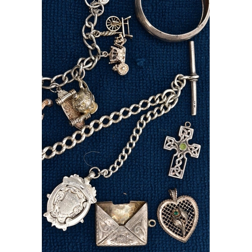 121 - A SELECTION OF SILVER AND WHITE METAL ITEMS, to include a silver charm bracelet suspending thirteen ... 