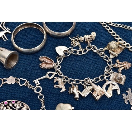 121 - A SELECTION OF SILVER AND WHITE METAL ITEMS, to include a silver charm bracelet suspending thirteen ... 