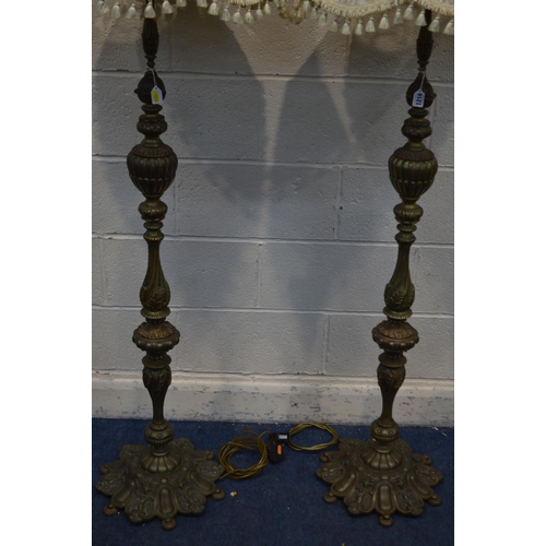 1216 - A PAIR OF EARLY 20TH CENTURY HEAVY BRASS STANDARD LAMPS, with a fabric shade, height to fitting 141c... 