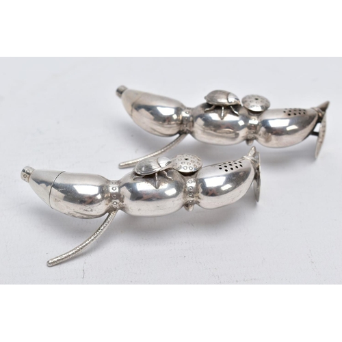 127 - A PAIR OF EARLY 20TH CENTURY CHINESE SILVER PEPPERETTES, in the form of bean or seed pods, each with... 