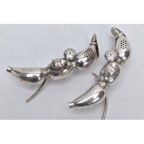 127 - A PAIR OF EARLY 20TH CENTURY CHINESE SILVER PEPPERETTES, in the form of bean or seed pods, each with... 