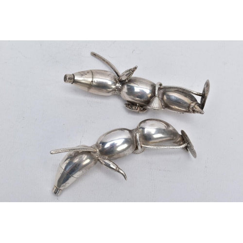 127 - A PAIR OF EARLY 20TH CENTURY CHINESE SILVER PEPPERETTES, in the form of bean or seed pods, each with... 