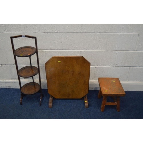 1395 - AN OAK FOLDING THREE TIER CAKE STAND, along with a folding occasional table and a stool (3)