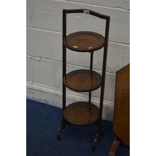 1395 - AN OAK FOLDING THREE TIER CAKE STAND, along with a folding occasional table and a stool (3)