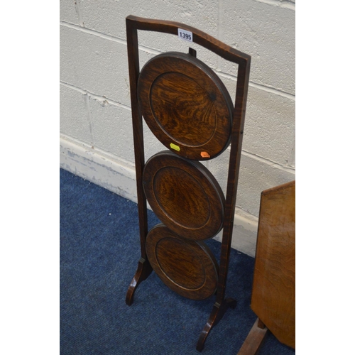 1395 - AN OAK FOLDING THREE TIER CAKE STAND, along with a folding occasional table and a stool (3)