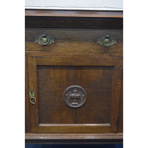 1396 - AN EARLY 20TH CENTURY OAK CUPBOARD, with a raised back, with a single drawer above a single cupboard... 