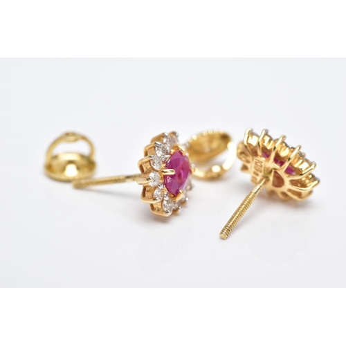 15 - A PAIR OF 18CT GOLD RUBY AND DIAMOND CLUSTER EARRINGS, each designed with a central claw set, oval c... 