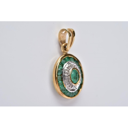 23 - A 9CT GOLD EMERALD AND DIAMOND PENDANT, of an oval form set with a central oval cut emerald within a... 