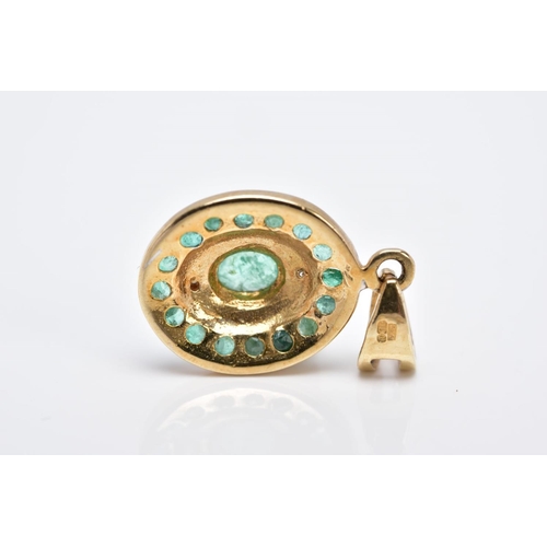 23 - A 9CT GOLD EMERALD AND DIAMOND PENDANT, of an oval form set with a central oval cut emerald within a... 