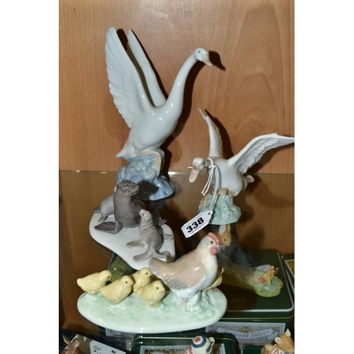 338 - A SMALL GROUP OF LLADRO AND NAO comprising Lladro Duck taking flight No1264 and mini Seal Family No ... 