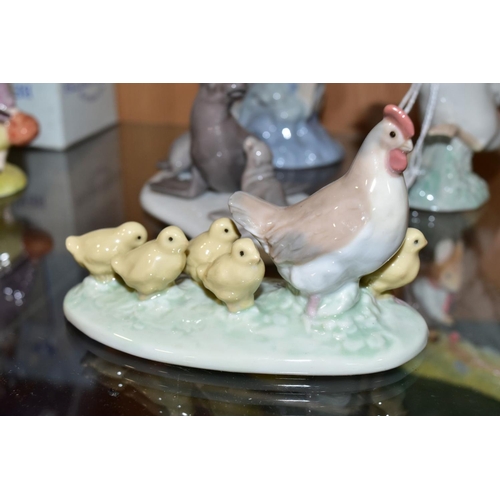 338 - A SMALL GROUP OF LLADRO AND NAO comprising Lladro Duck taking flight No1264 and mini Seal Family No ... 