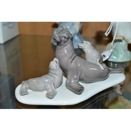 338 - A SMALL GROUP OF LLADRO AND NAO comprising Lladro Duck taking flight No1264 and mini Seal Family No ... 