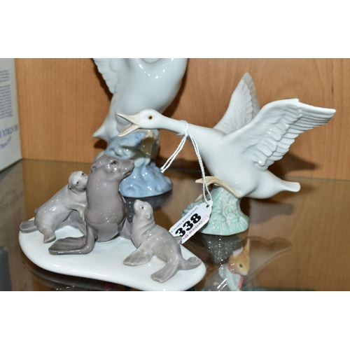 338 - A SMALL GROUP OF LLADRO AND NAO comprising Lladro Duck taking flight No1264 and mini Seal Family No ... 