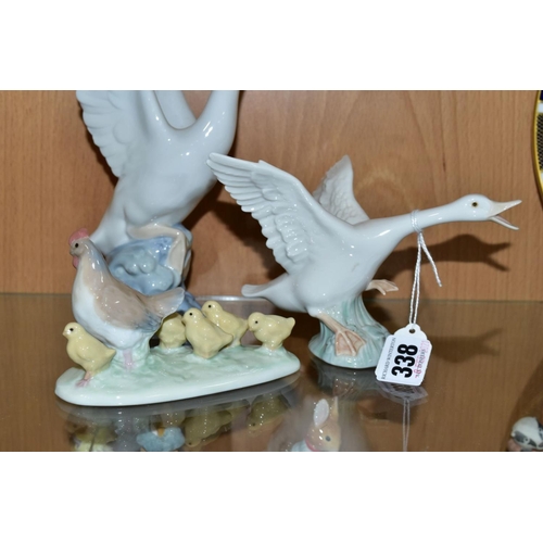 338 - A SMALL GROUP OF LLADRO AND NAO comprising Lladro Duck taking flight No1264 and mini Seal Family No ... 