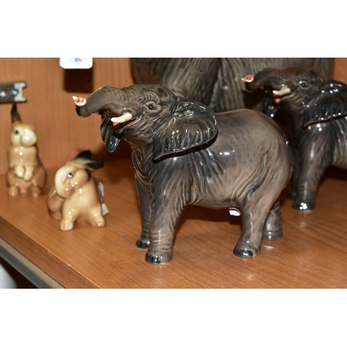 351 - A GROUP OF BESWICK, comprising three Elephants, two small No 974 with trunks stretched (one with reg... 