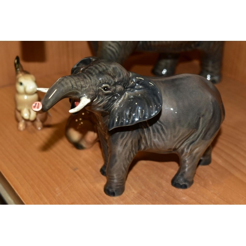 351 - A GROUP OF BESWICK, comprising three Elephants, two small No 974 with trunks stretched (one with reg... 