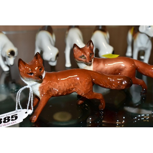 385 - BESWICK FOXES AND FOXHOUNDS, comprising two foxes No 1440 (leg reglued on one), two foxhounds No 941... 