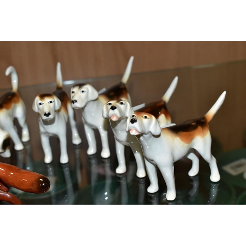 385 - BESWICK FOXES AND FOXHOUNDS, comprising two foxes No 1440 (leg reglued on one), two foxhounds No 941... 