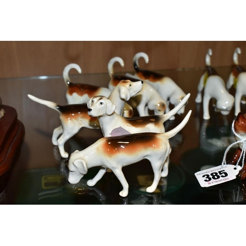 385 - BESWICK FOXES AND FOXHOUNDS, comprising two foxes No 1440 (leg reglued on one), two foxhounds No 941... 