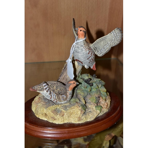 408 - THREE BORDER FINE ARTS SCULPTURES, 'Cock Pheasant' R821 and 'Hen Pheasant and chicks' RB22, both by ... 