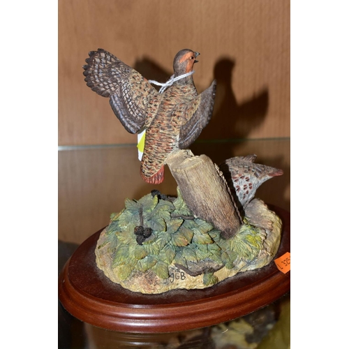 408 - THREE BORDER FINE ARTS SCULPTURES, 'Cock Pheasant' R821 and 'Hen Pheasant and chicks' RB22, both by ... 