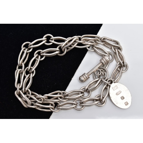 45 - A WHITE METAL CHAIN WITH A SILVER FOB, the chain fitted with fancy openwork links fitted with a T-ba... 