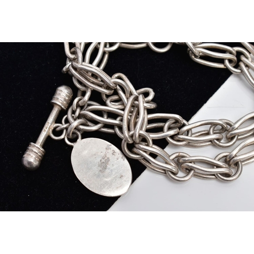 45 - A WHITE METAL CHAIN WITH A SILVER FOB, the chain fitted with fancy openwork links fitted with a T-ba... 