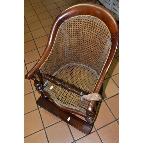 454 - A LATE 19TH CENTURY MAHOGANY CHILDS ARM CHAIR, with Bergere seat and back, removable foot rest, (con... 