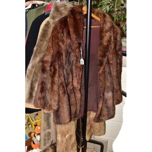 517 - A GROUP OF LADIES COATS, GILETS, DRESSES, ETC, to include a short brown mink fur jacket, a long ligh... 