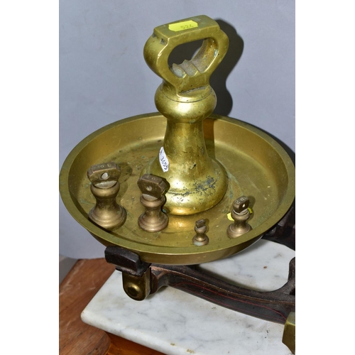 524 - A SET OF BERRY AND WARMINGTON BALANCE SCALES, mantel on a marble topped wooden plinth, retail scales... 