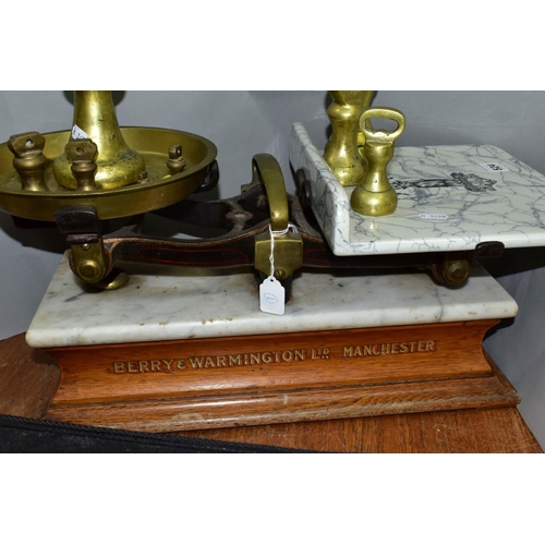 524 - A SET OF BERRY AND WARMINGTON BALANCE SCALES, mantel on a marble topped wooden plinth, retail scales... 