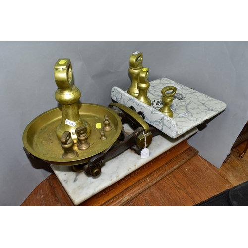 524 - A SET OF BERRY AND WARMINGTON BALANCE SCALES, mantel on a marble topped wooden plinth, retail scales... 