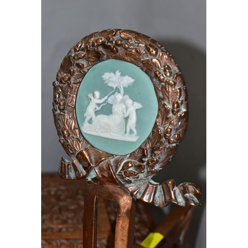 525 - A PAIR OF COPPER ART NOUVEAU FIRE DOGS, with green Jasper style plaques inset into a Laurel Wreath f... 