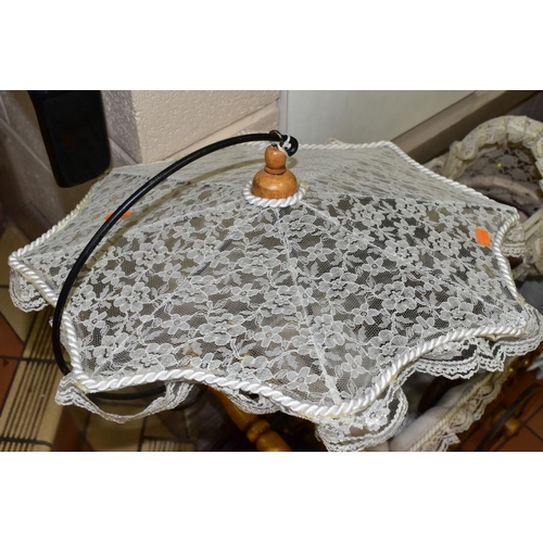 531 - A MODERN REPRODUCTION DOLLS PRAM, with integral lace parasol, complete and in fairly good condition,... 