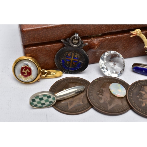 54 - A SMALL BROWN BOX WITH CONTENTS, to include a silver fob with a blue, yellow and orange enamel shiel... 