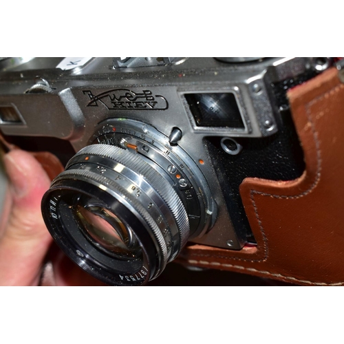 593 - A RUSSIAN KIEV RANGEFINDE CAMERA, complete with 53mm f2 interchangable  lens and leather case, toget... 