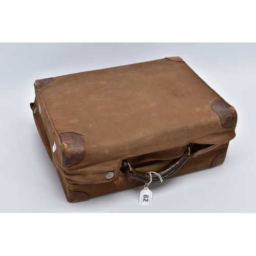 62 - A GENTLEMANS GROOMING TRAVEL CASE, a brown leather case with a brown outer push button cover, presse... 