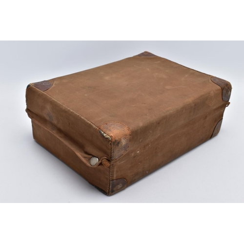 62 - A GENTLEMANS GROOMING TRAVEL CASE, a brown leather case with a brown outer push button cover, presse... 