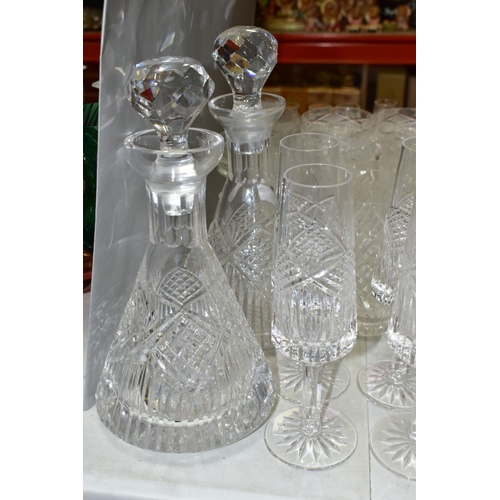 625 - A MATCHED SUITE OF CUT GLASS DRINKING GLASSES, together with a pair of conical shaped decanters, to ... 