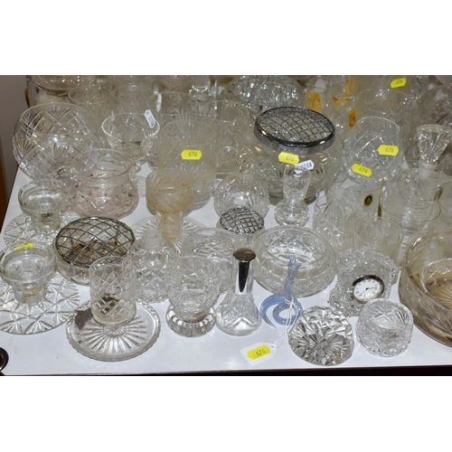 676 - A QUANTITY OF GLASSWARE, including drinking glasses, bowls, jugs, decanters, rose bowls, vases, perf... 