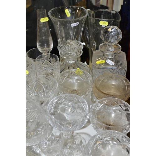 676 - A QUANTITY OF GLASSWARE, including drinking glasses, bowls, jugs, decanters, rose bowls, vases, perf... 