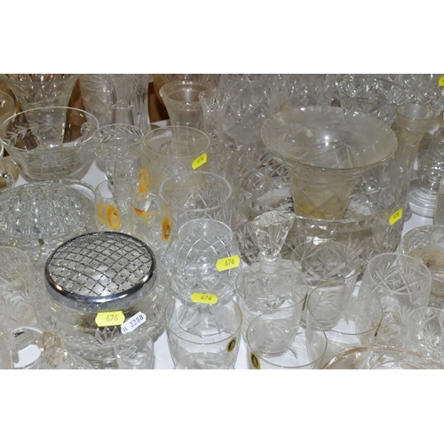 676 - A QUANTITY OF GLASSWARE, including drinking glasses, bowls, jugs, decanters, rose bowls, vases, perf... 