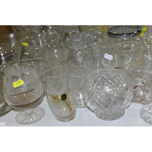 676 - A QUANTITY OF GLASSWARE, including drinking glasses, bowls, jugs, decanters, rose bowls, vases, perf... 