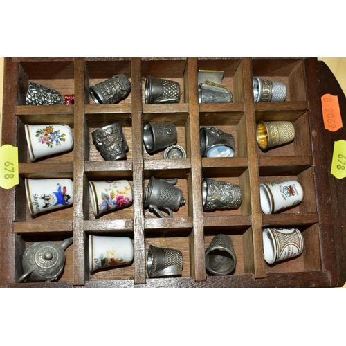 678 - THREE WOODEN DISPLAY SHELVES OF METAL AND CERAMIC THIMBLES AND SOUVENIR SPOONS, together with a smal... 