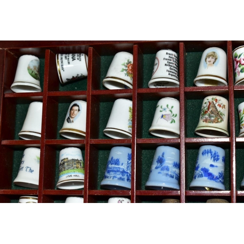 678 - THREE WOODEN DISPLAY SHELVES OF METAL AND CERAMIC THIMBLES AND SOUVENIR SPOONS, together with a smal... 